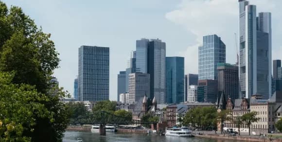 Frankfurt skyline with the river Main and the Commerzbank Tower in daylight